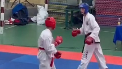 Two Taekwondo athletes meant to fight end up falling together without hitting anyone