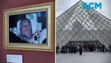 Activists literally hang Prince Andrew arrest photo inside Louvre