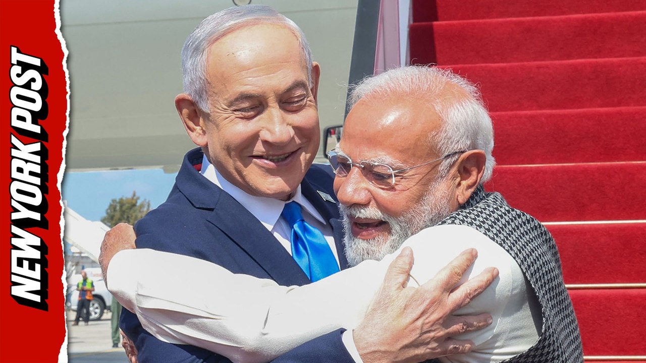 Israeli Prime Minister Netanyahu embraces Indian Prime Minister Modi when he lands in Israel