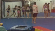 Cheerleader performs running back handspring and crashes into spotter