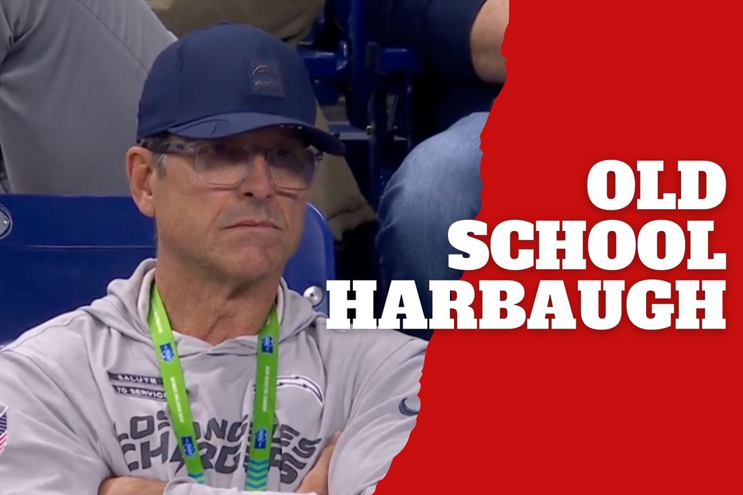 Jim Harbaugh skips the luxury suite and watches from the stands like it’s old school football