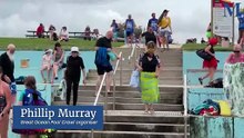 Swimmers take part in the 21st Great Ocean Pool Crawl at Towradgi.