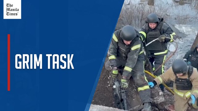 Ukrainian emergency workers clear debris to retrieve bodies after Russian strikes on border areas