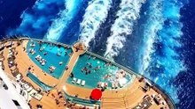 Luxury Cruise Ship Sailing Across Deep Blue Ocean