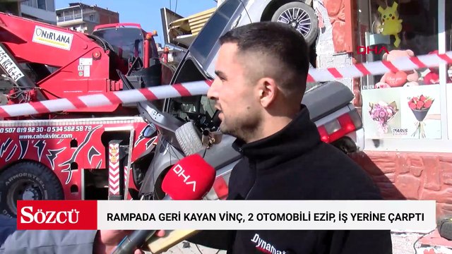 Rampada geri kayan vinç, 2 otomobili ezip, aydınlatma direği ile iş yerine çarptı