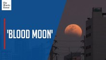 Moon turns deep red over metro skyline as it enters total lunar eclipse