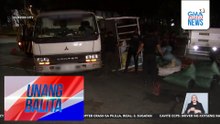 Elf truck, tumagilid sa elliptical road; sako-sakong uling na karga nito, nahulog at kumalat | Unang Balita