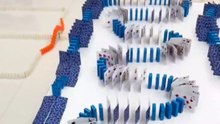 Domino sequence falls in flawless order, creating a delightful visual experience