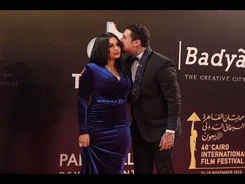 قبلة أحمد الفيشاوي لزوجته على السجادة الحمراء بافتتاح مهرجان القاهرة السينمائي