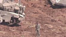 Israel gathers armored vehicles at the Israel-Lebanon border