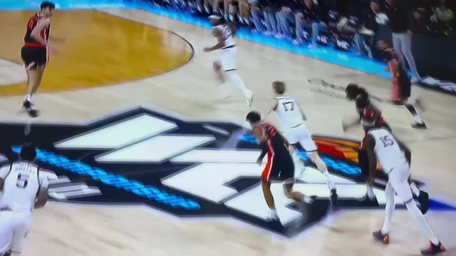 College basketball player crashes into cheerleaders and goes viral