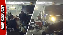 Wild moment car smashes through barbershop window