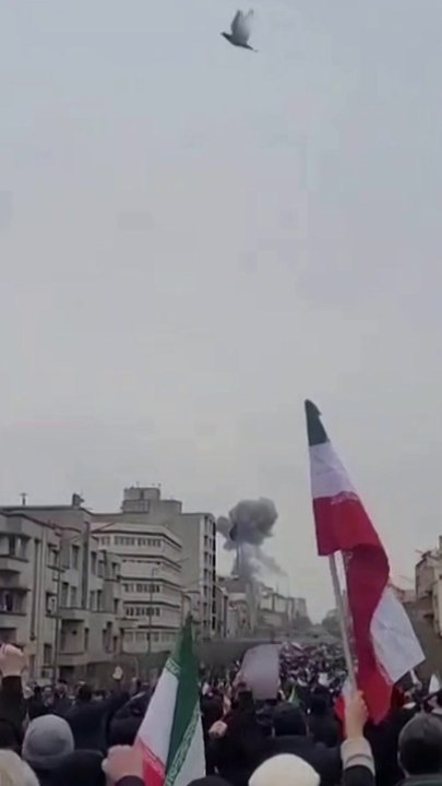 Large explosion fills the sky during Iranian march in Tehran