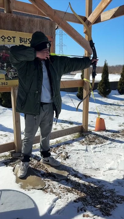 First time shooting a recurve bow… and he hits the bullseye. 🎯