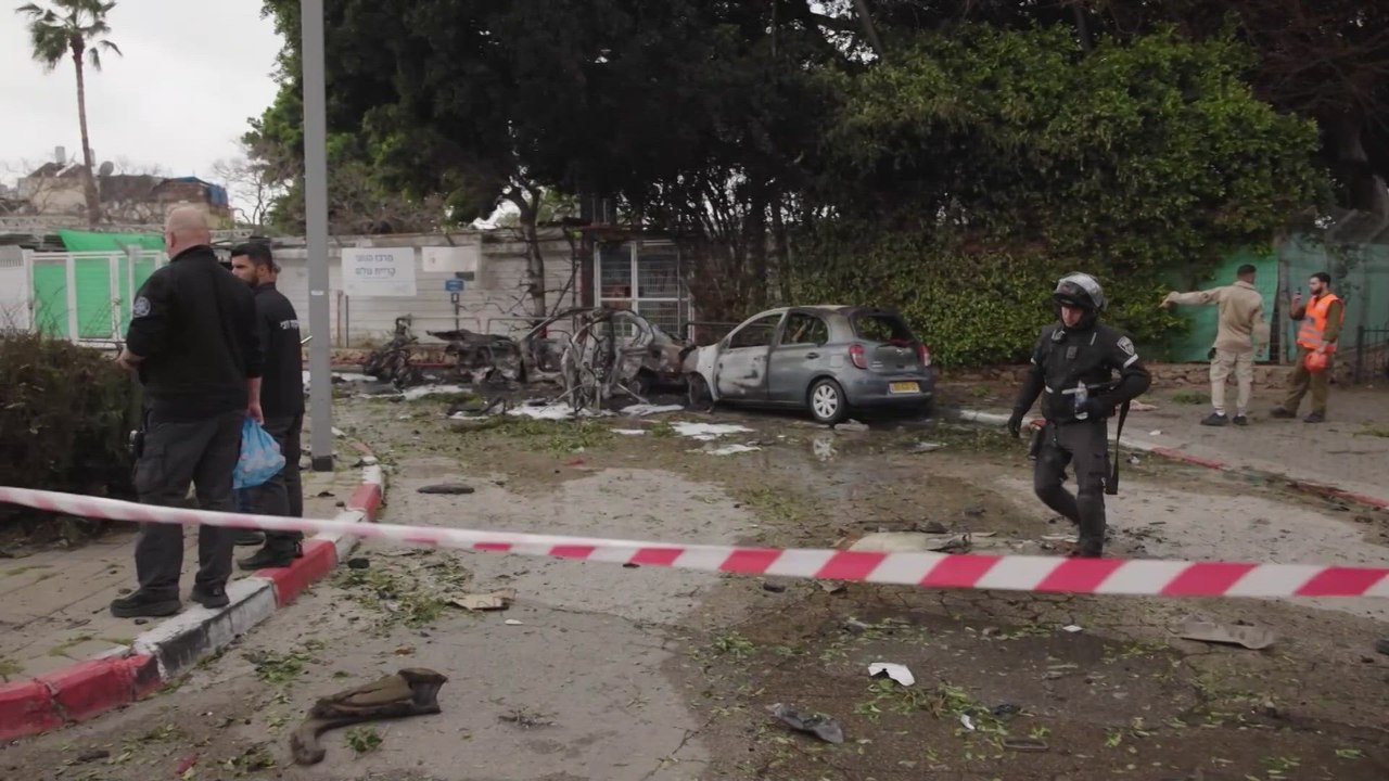 Chaos in Tel Aviv: Burnt Cars and Craters After Iranian Missile Strikes