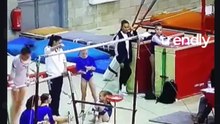 Young Gymnast Loses Grip on Bar During Contest and Falls