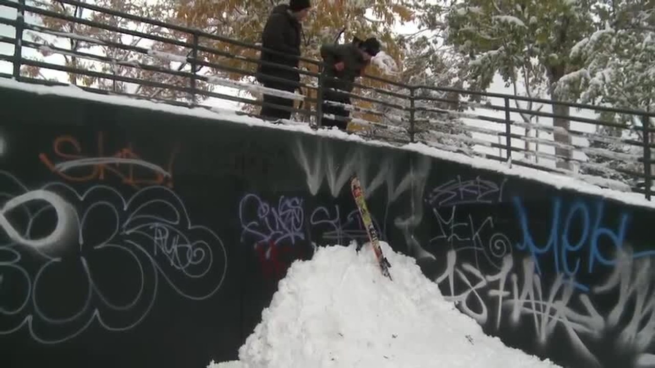 Person Skis Down Small Snow Pile