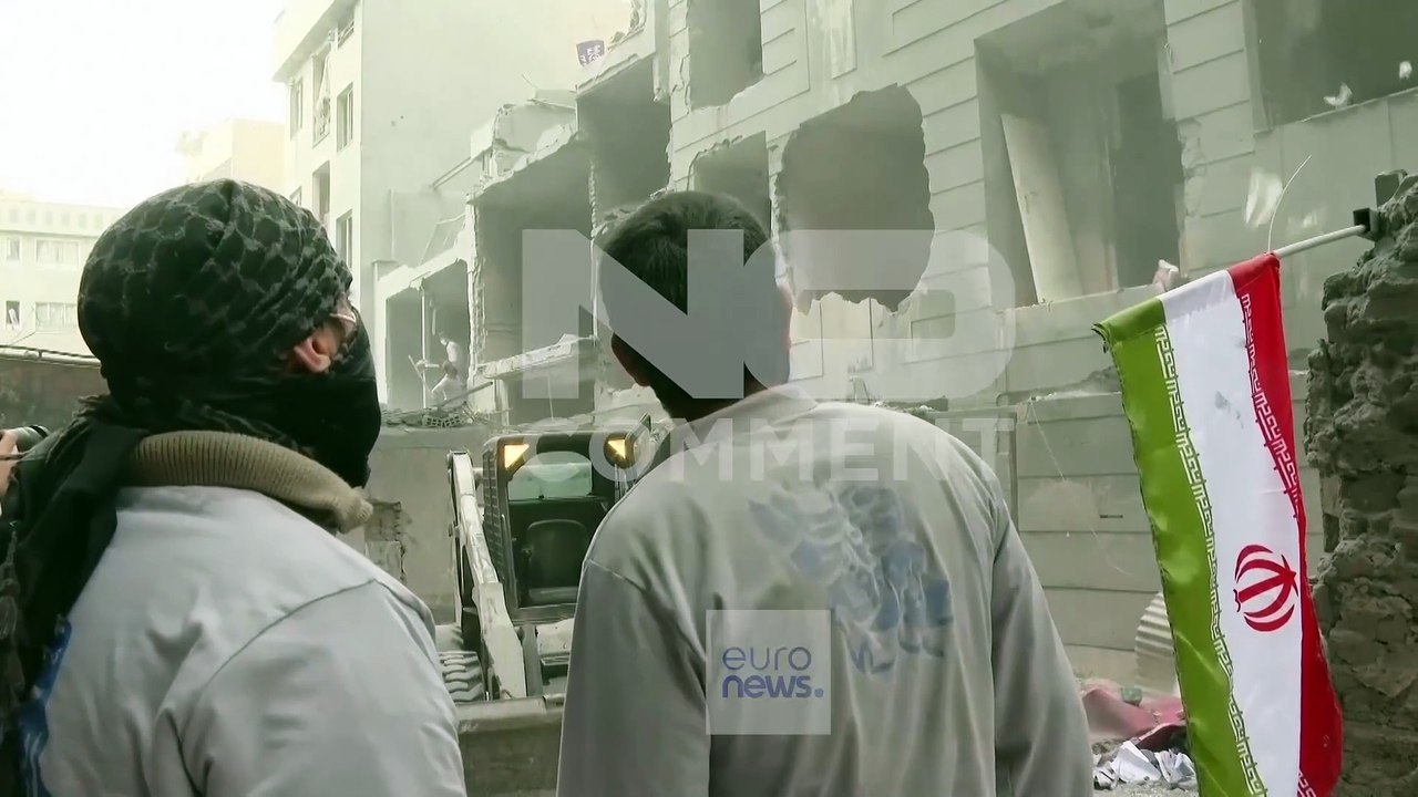 Residents clear rubble after strike damages buildings in southern Tehran