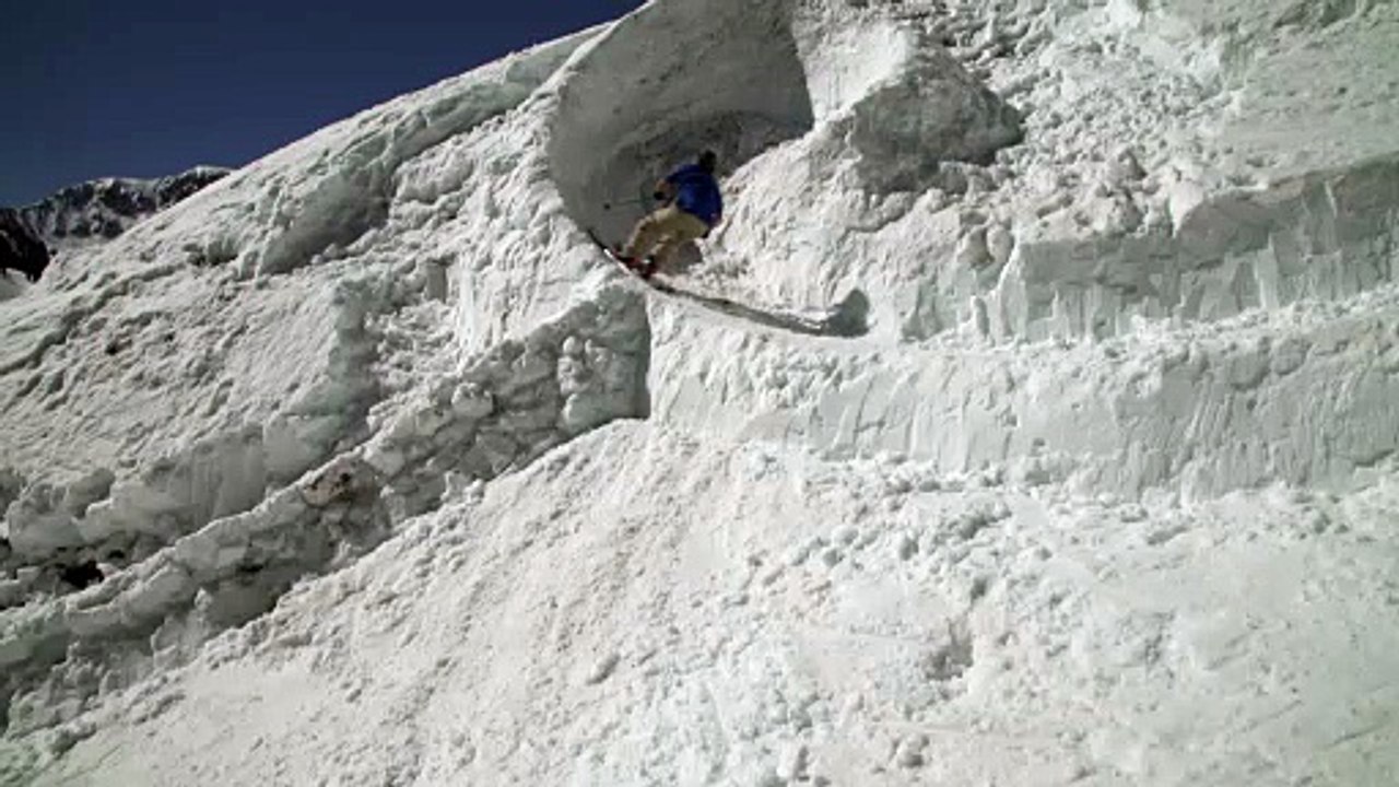 Skier Falls While Skiing Down Mountain