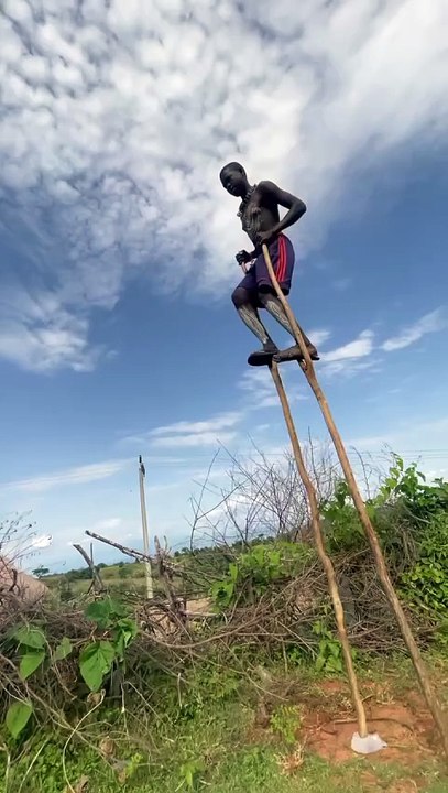 Bena Boy Walking on Tall Stilts in Omo Valley Ethiopia 🎥 @reshid_002