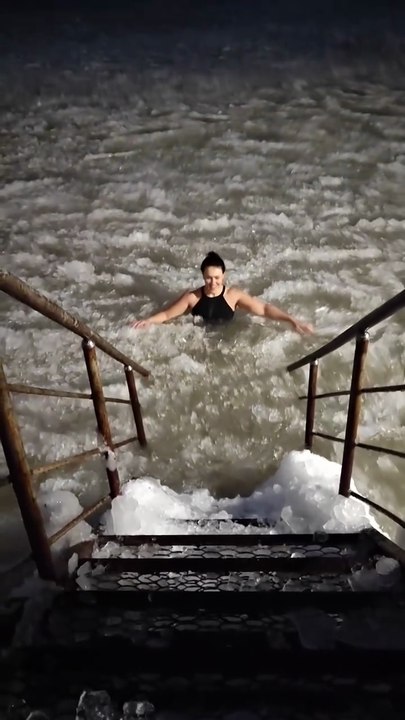 Amazing Ice Bath Experience: Woman Swimming in Icy River