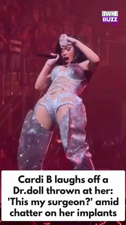 American rapper Cardi B laughs off a dr. doll thrown at her during music concert, amid chatter on her implants