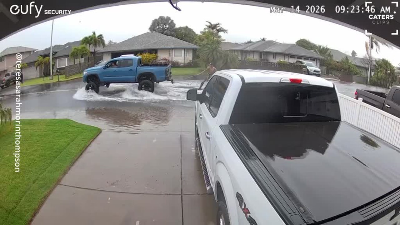 Flooded Street Turns Into Street Surfing