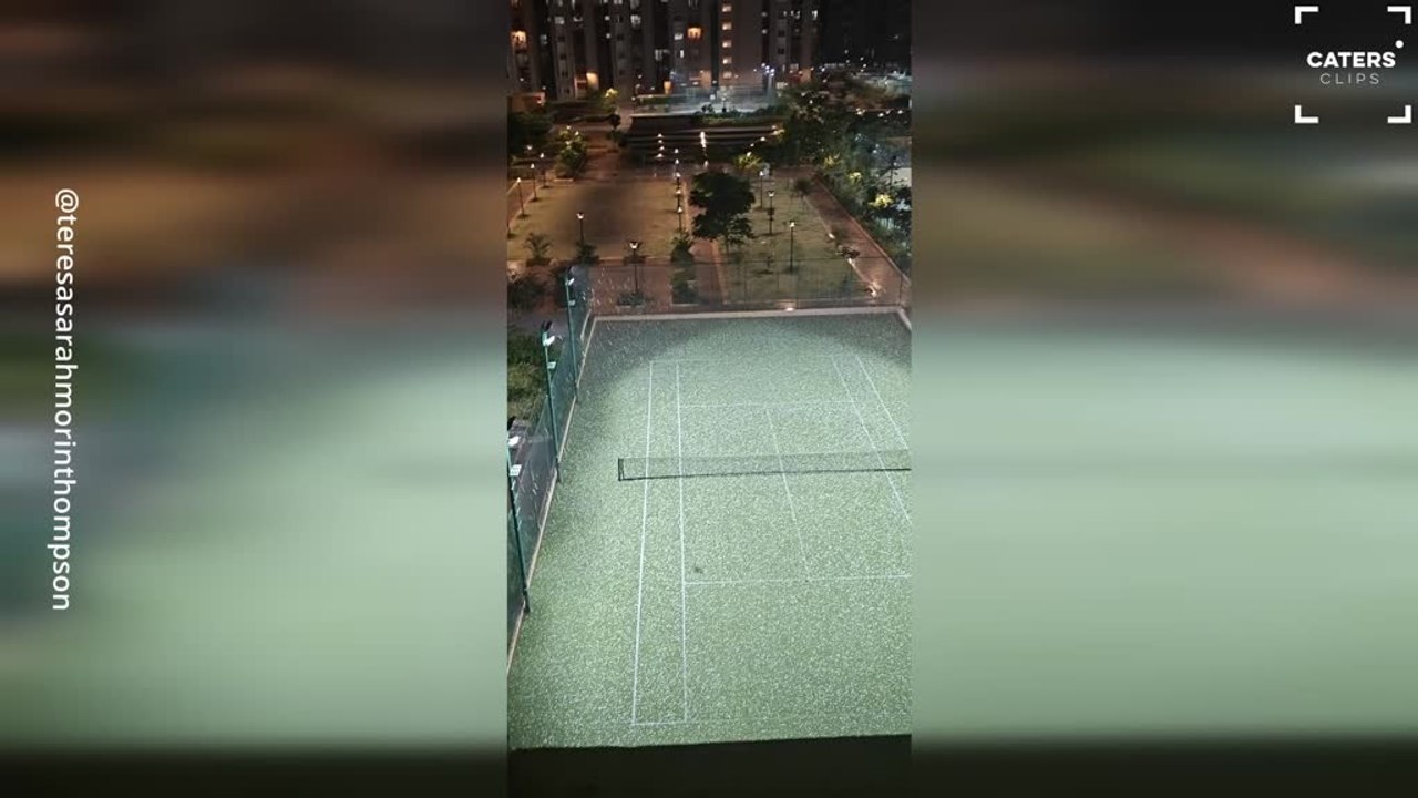 Intense Hailstorm Turns Tennis Court White