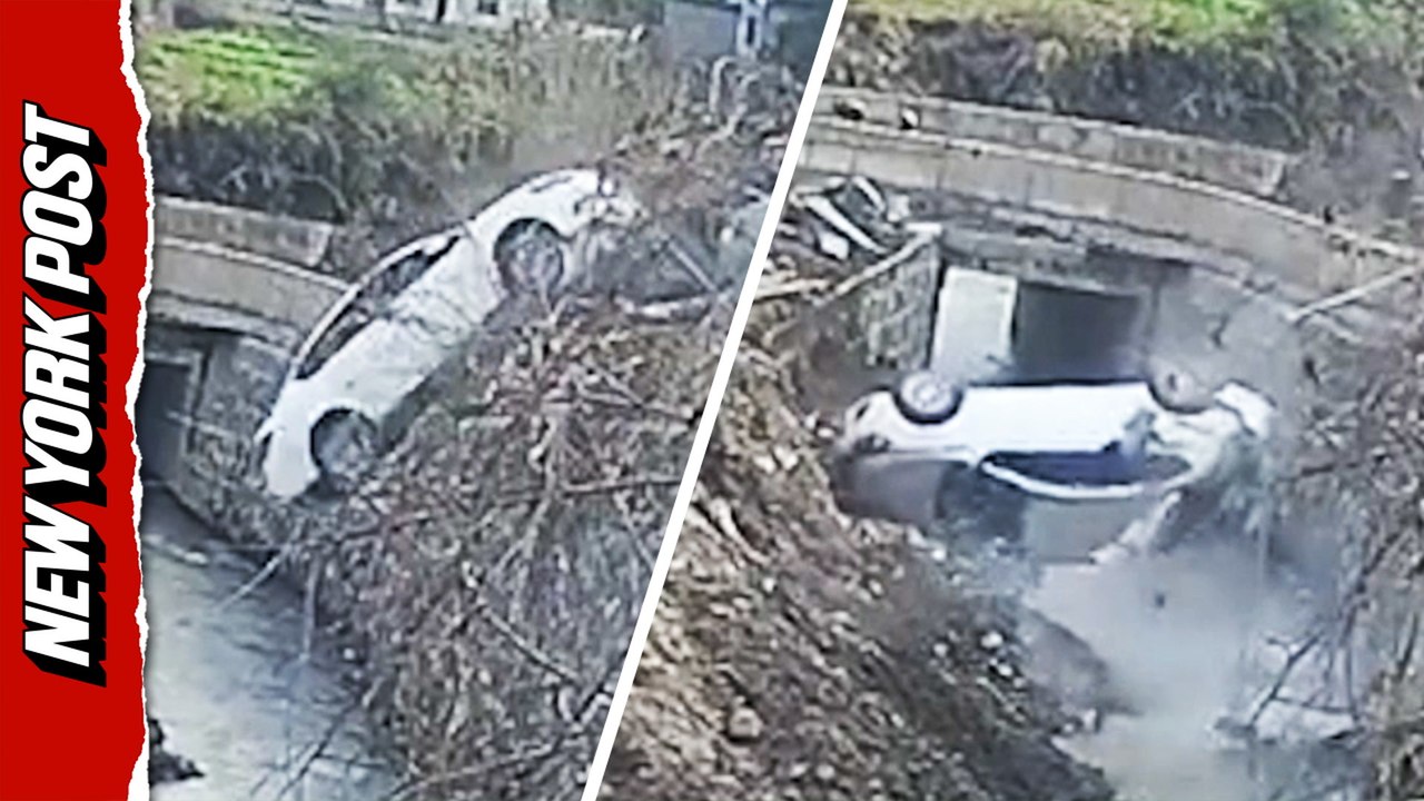 Terrifying moment car plunges backwards into creek