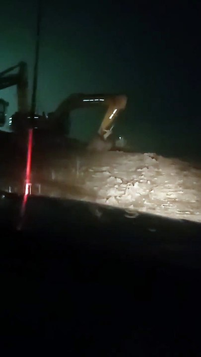 Giant Machines at Work : Night Mining Operations in Borneo