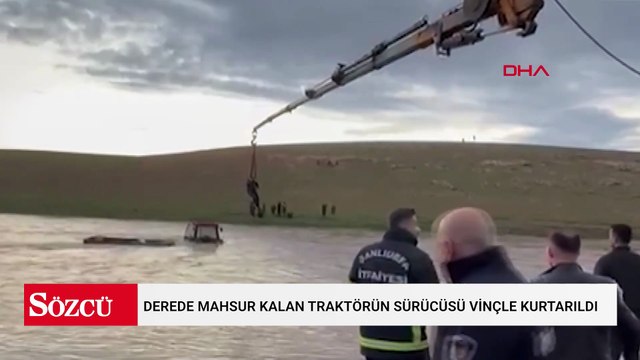 Derede mahsur kalan traktörün sürücüsü vinçle kurtarıldı