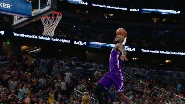 LeBron starts record-breaking night with monster dunk
