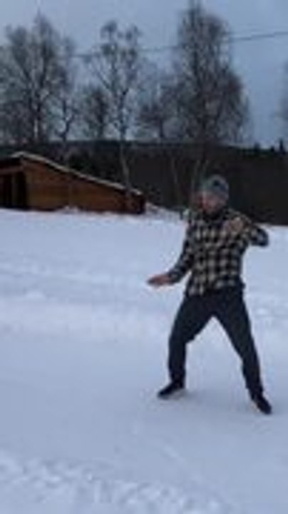 Snow Slide Turns Fun as Man Attempts Reverse Trick