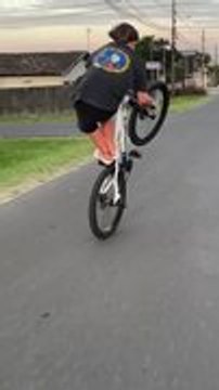 Person Falls Off Bike Attempting Stunt