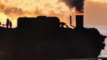 Fiery Steam Locomotive Journey at Sunset