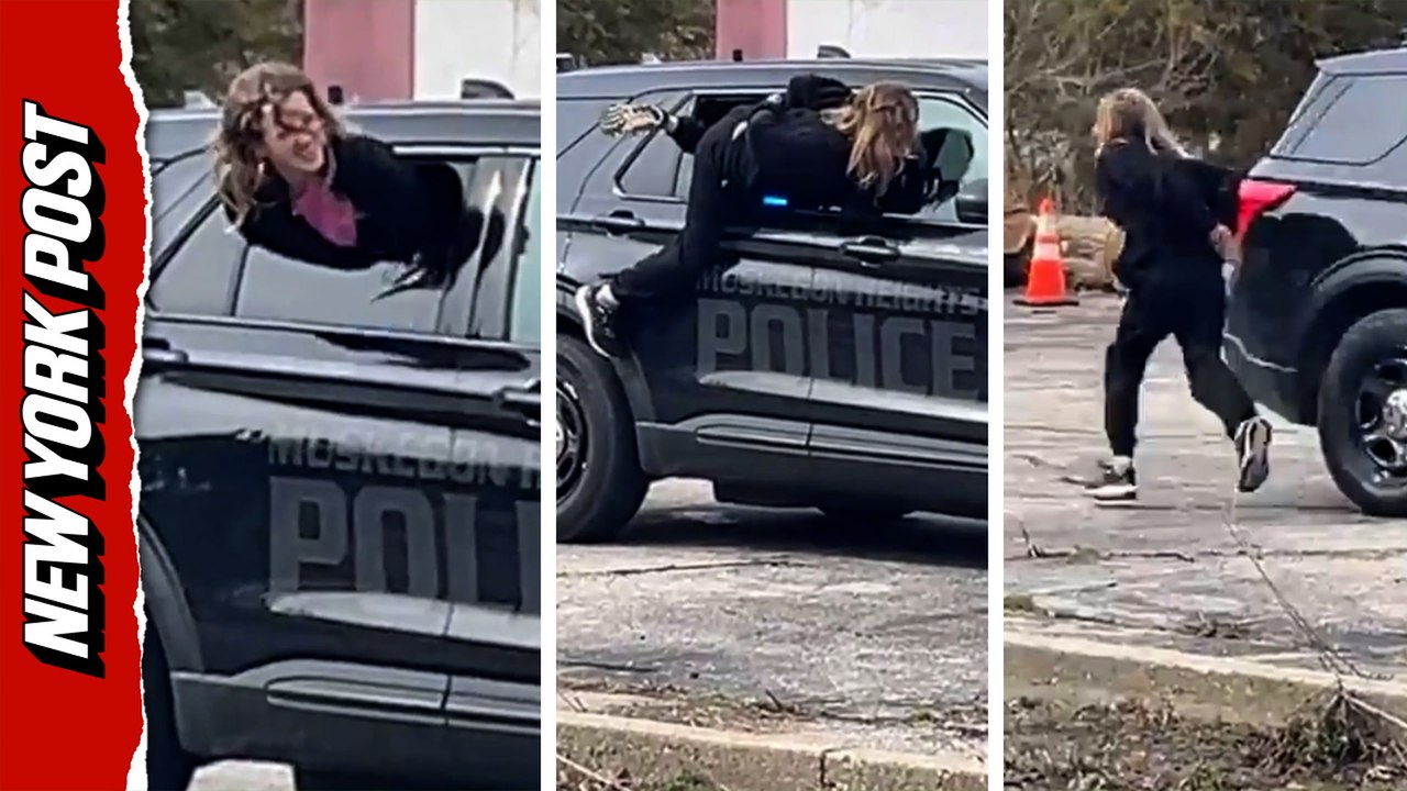Woman makes daring escape from Michigan cops by slipping through police car window