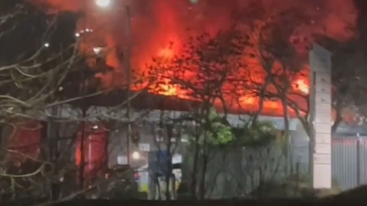 Shoppers evacuate Meadowhall in Sheffield after smoke from a large industrial fire fills the air