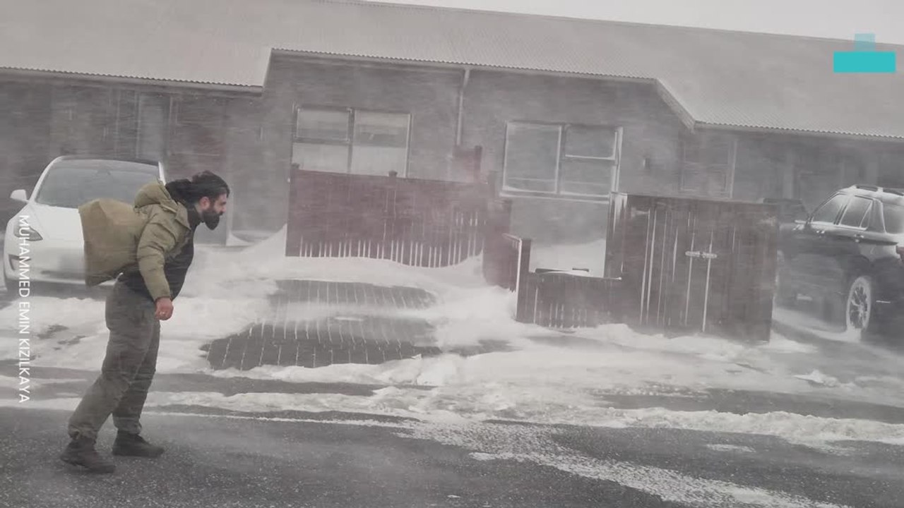 Man Battles Through Blizzard as Winds Turn Snow Sideways