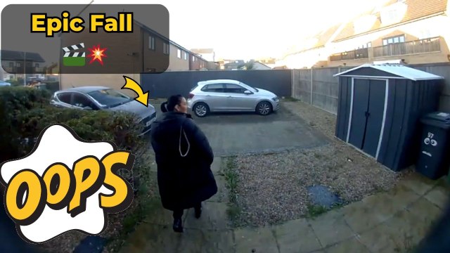 Ring camera footage of woman kicking off 2026 with a comical slip and fall