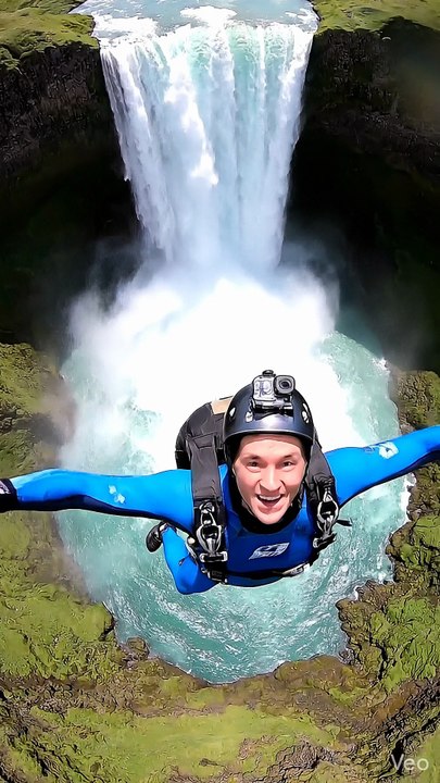 Man skydives into the waterfall