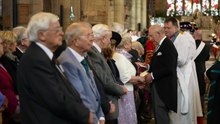 King greets members during a service in Wales