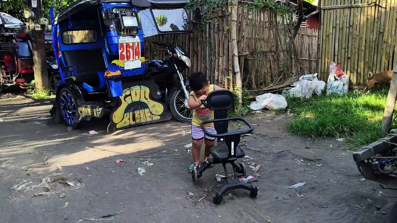 Isaiah Struggle to Push His Stroller Outside