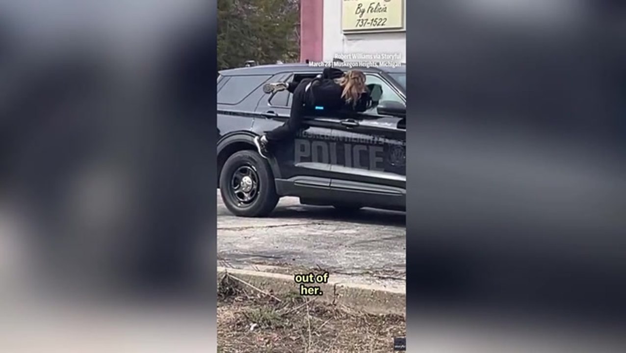 Handcuffed woman makes dramatic escape through police car window