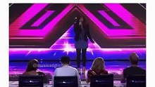 This video features a young woman auditioning on a talent show, where she announces her intention to sing “Baby” by Justin Bieber. As she begins her performance, the camera cuts between her spirited singing and the visibly bewildered or unimpressed reacti