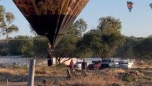 Hot air balloon lands all wrong and causes people to jump in for help