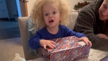 Little Boy Receives a Pair of Shoes From Grandparents and Drops It to the Floor