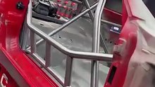 BMW E36 with a 12-point roll cage in progress on a Celette Sevenne frame machine