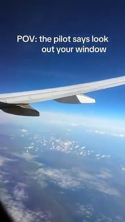 Humans flying over the Earth, while watching humans fly to the moon