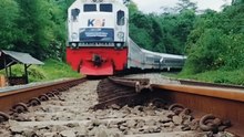 Majestic Indonesian KAI Train Navigating Through Green Hills
