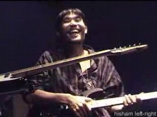 Hisham Playing Two Guitar